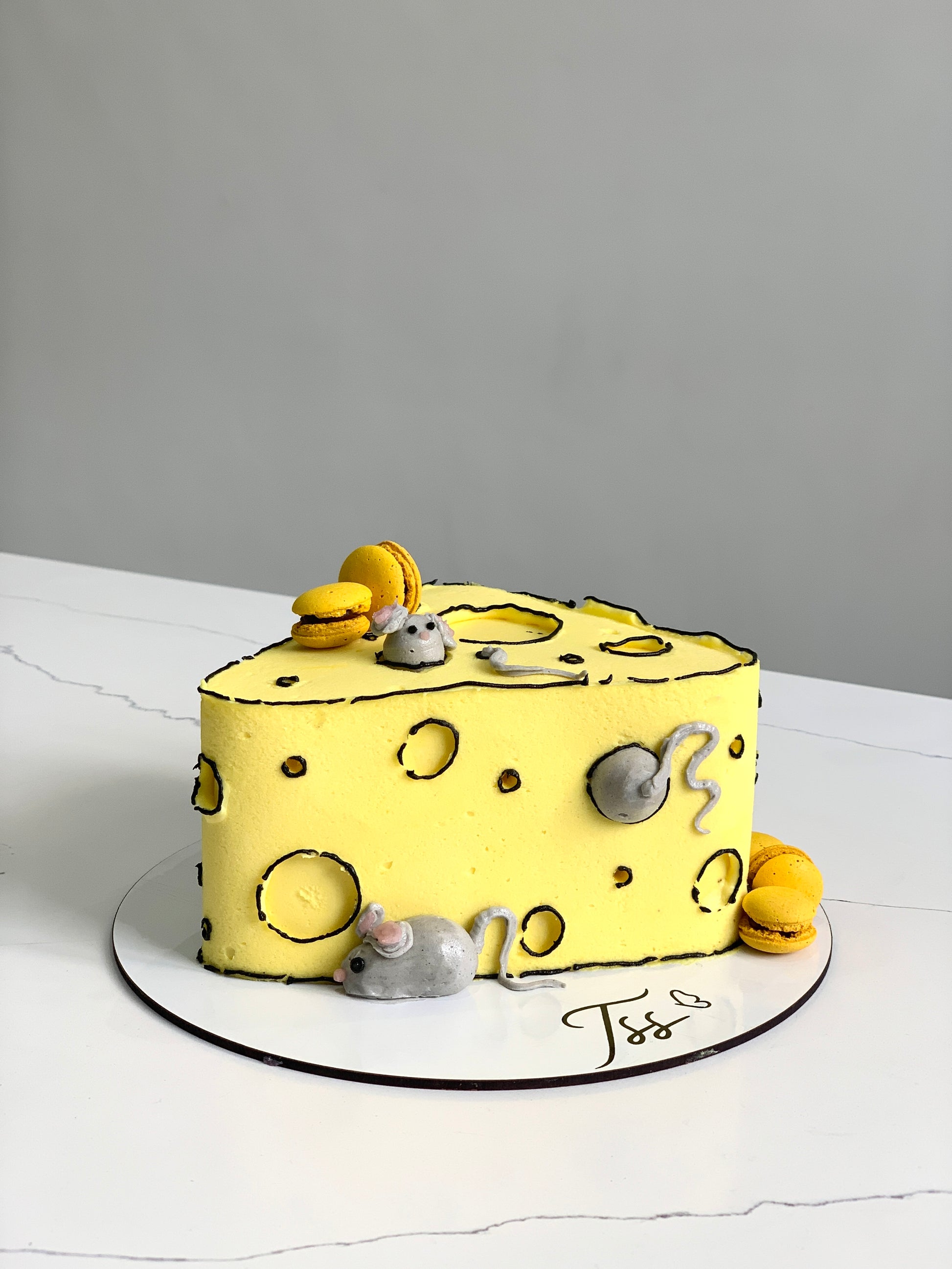 Colorful comic cake with vibrant frosting and detailed superhero-themed decorations from The Sinful Spoon.