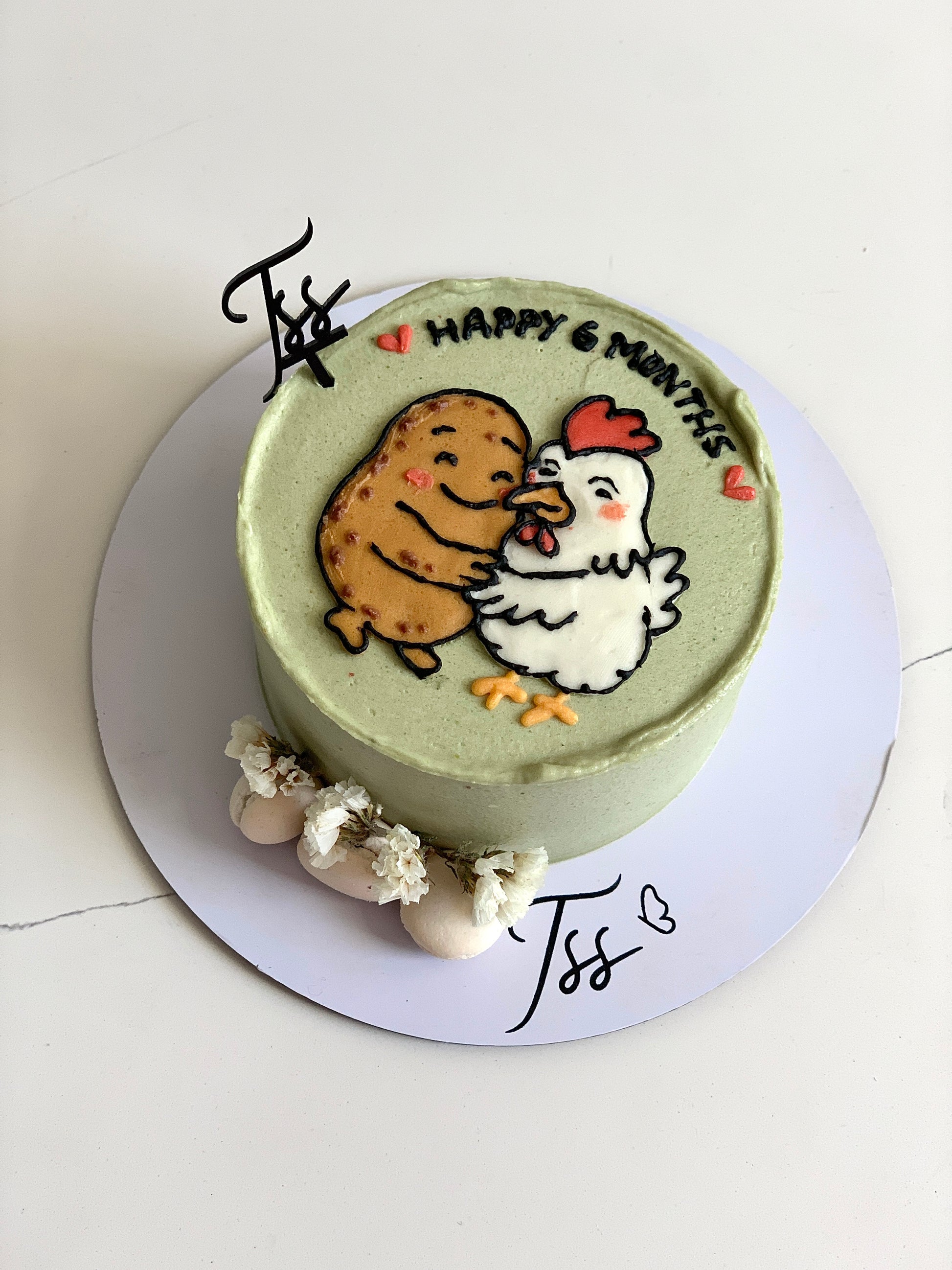Buttercream illustration cake by The Sinful Spoon featuring colorful, detailed floral and artistic piping decorations.