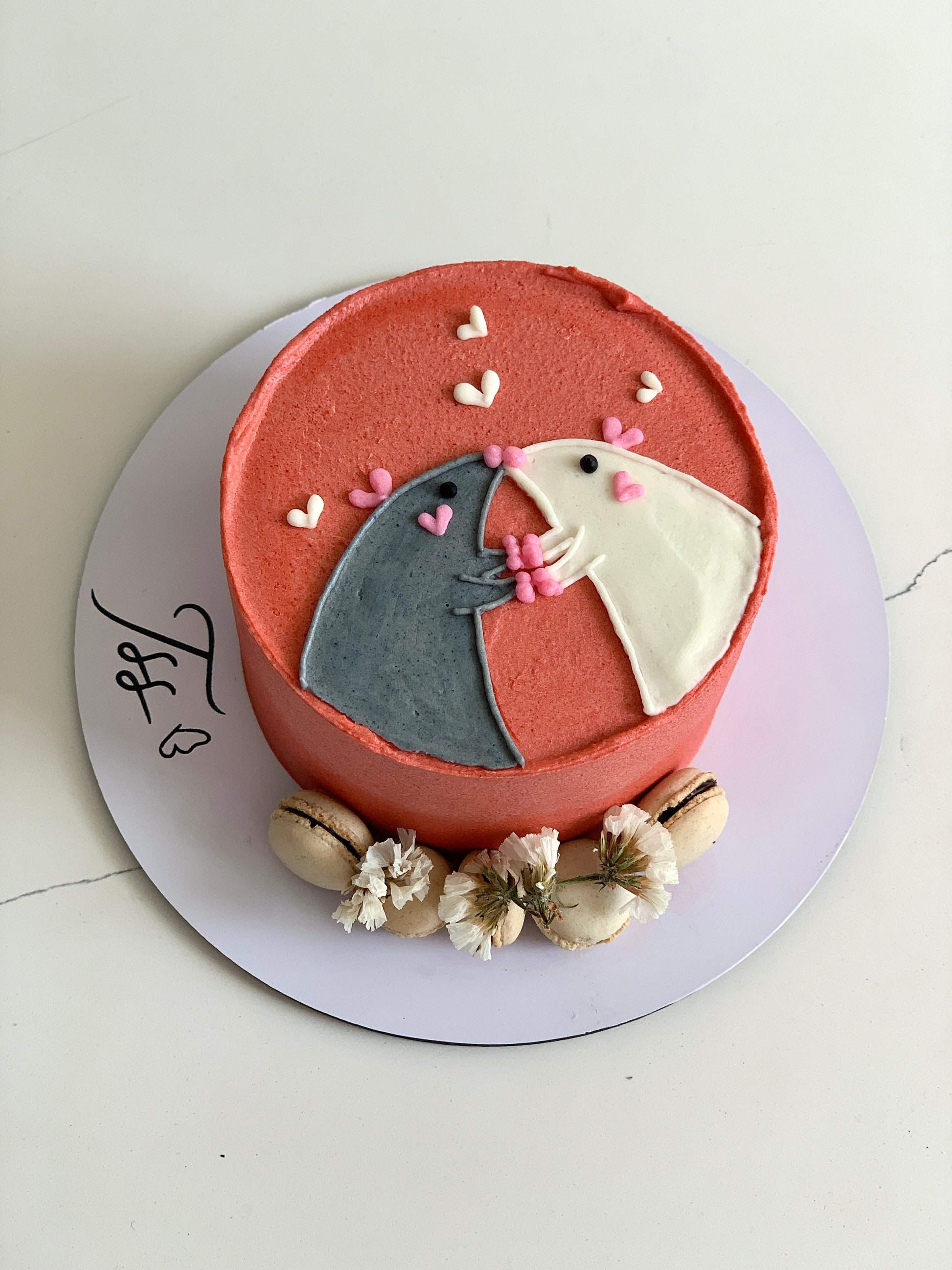 Buttercream illustration cake by The Sinful Spoon featuring colorful floral and whimsical designs on a round cake.