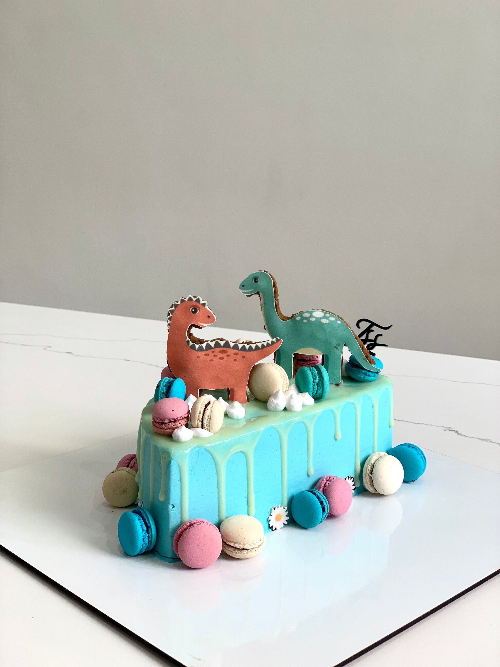 Half birthday cake from The Sinful Spoon with colorful frosting and decorative toppings, perfect for celebrating special occasions.