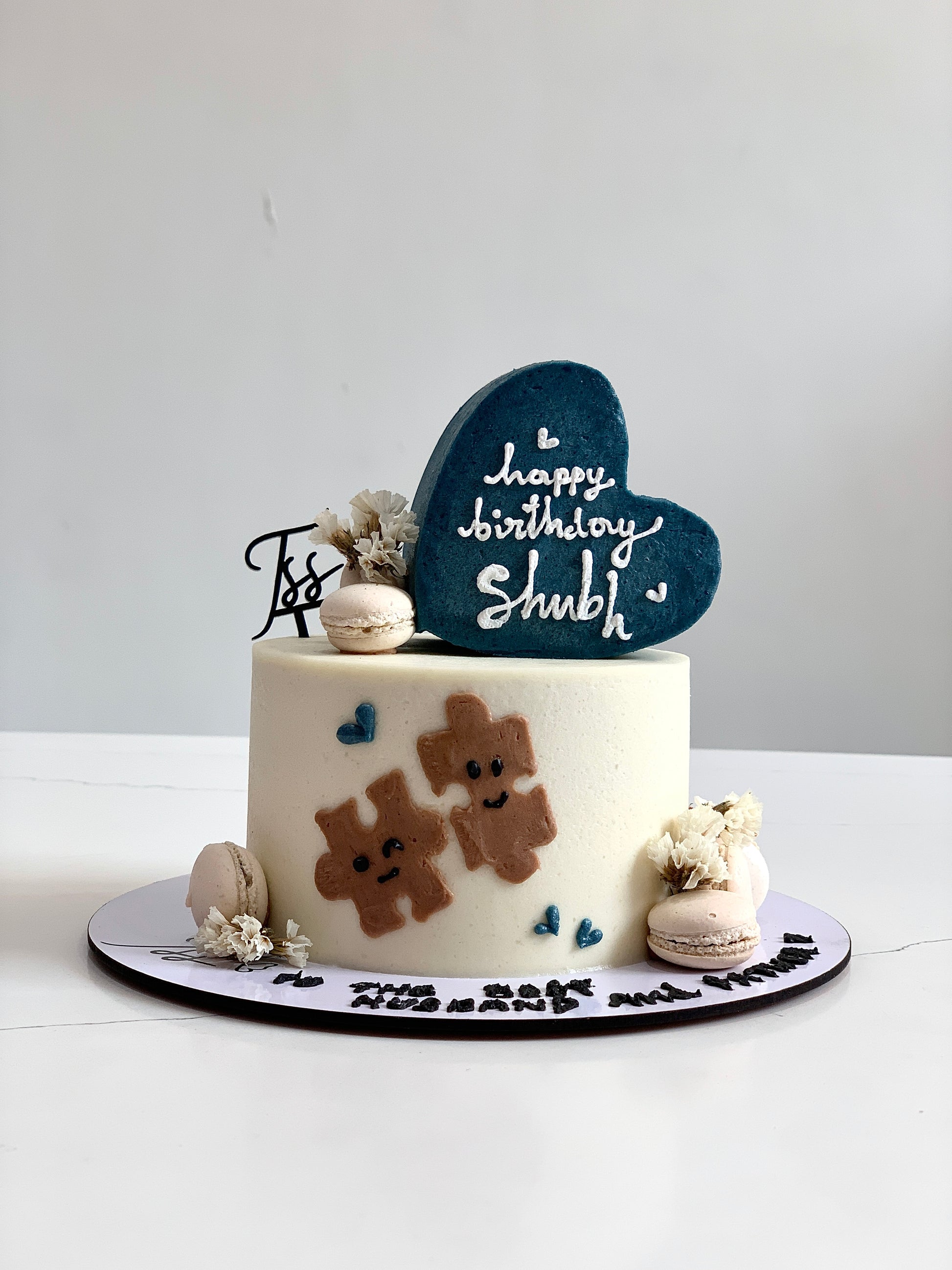 Heart-shaped cakes from The Sinful Spoon, decorated with pink and white icing, perfect for special occasions.