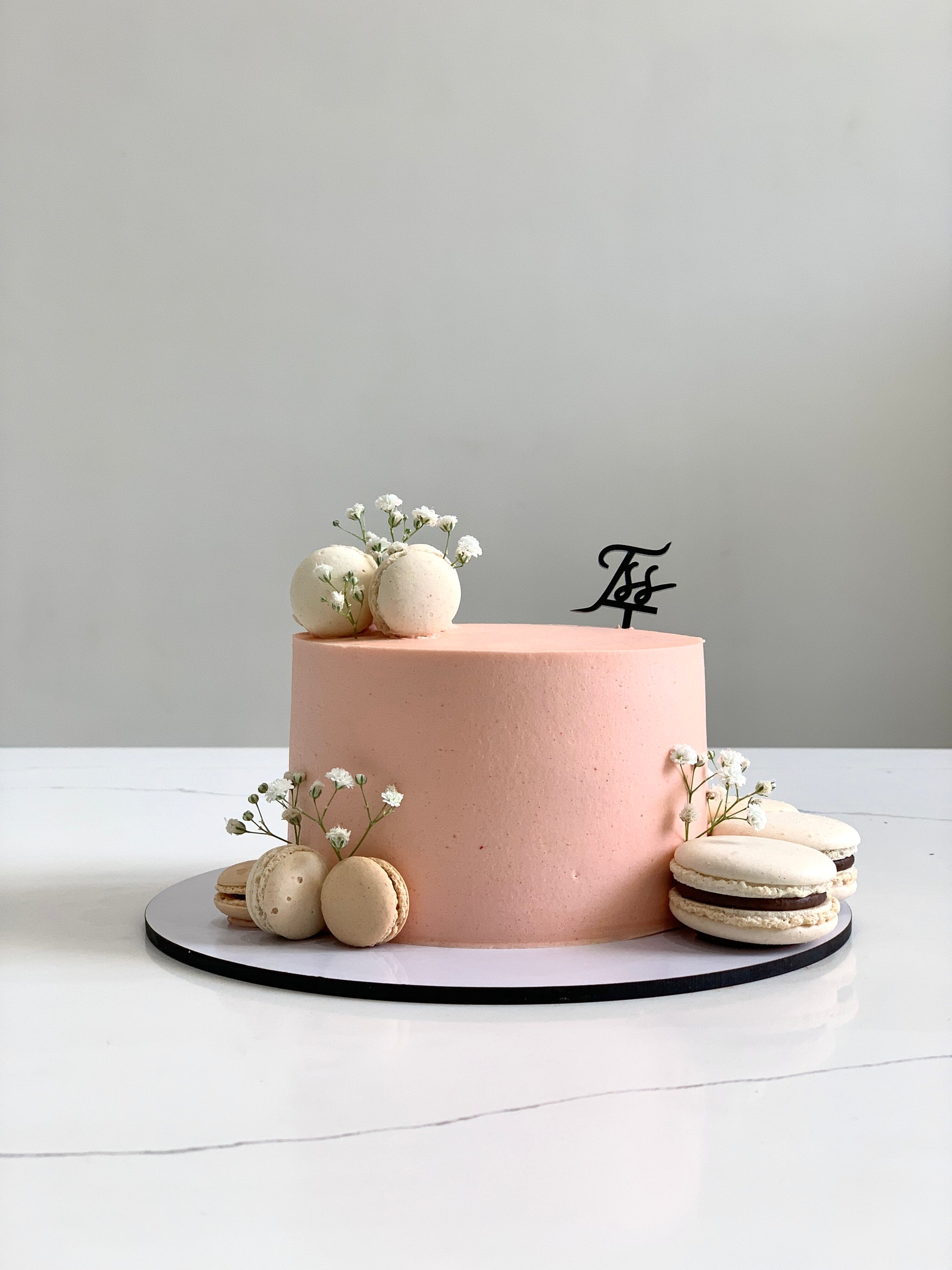 Classic cakes from The Sinful Spoon, showcasing a variety of fresh, colorful baked cakes with frosting and decorative toppings.