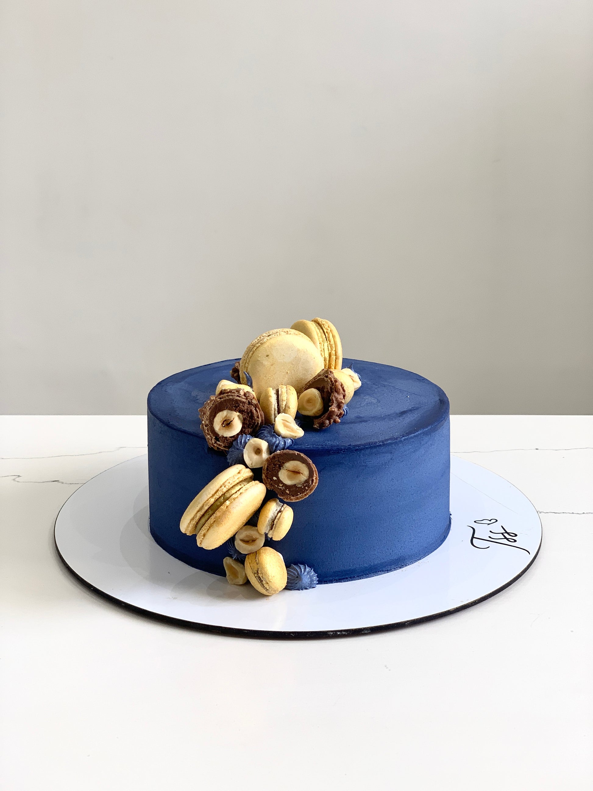 Decorative Father’s Day cake from The Sinful Spoon with colorful frosting and festive design, perfect for celebrating dads.
