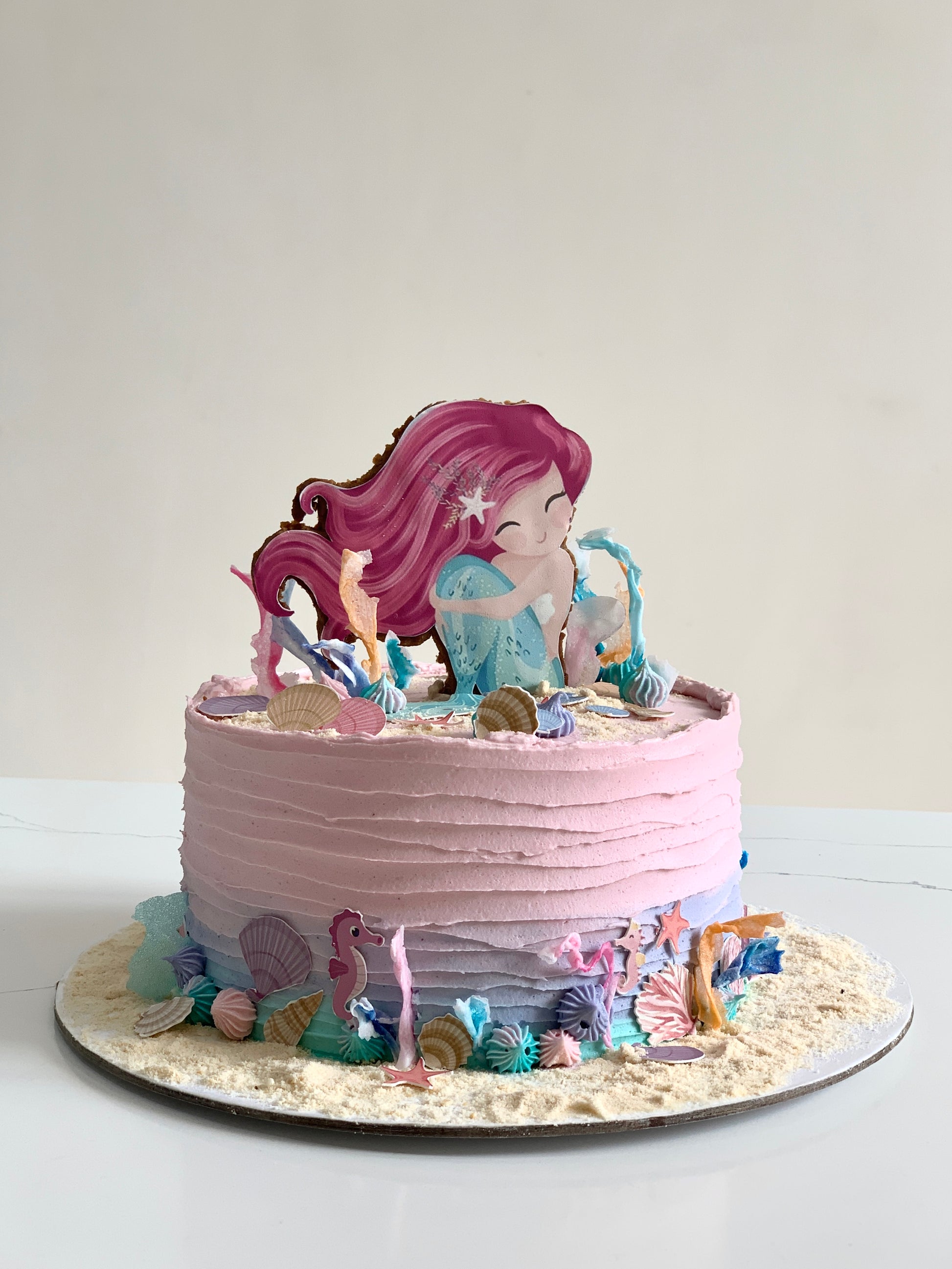 Edible paper cake topper featuring a baby girl design from The Sinful Spoon, perfect for baby shower celebrations.