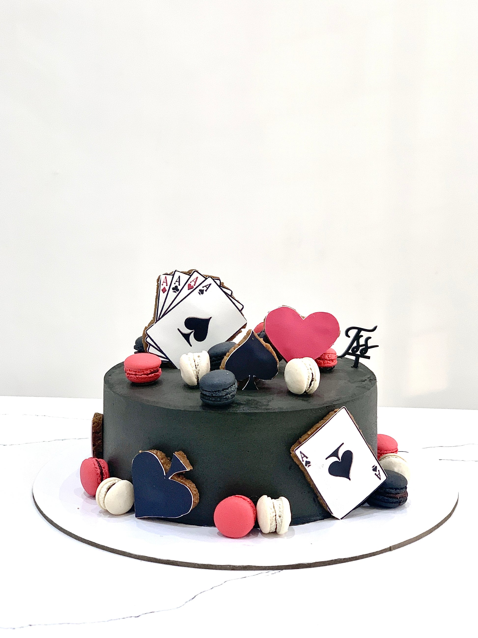 Decorative festive cakes from The Sinful Spoon featuring colorful icing and holiday-themed designs for celebrations.