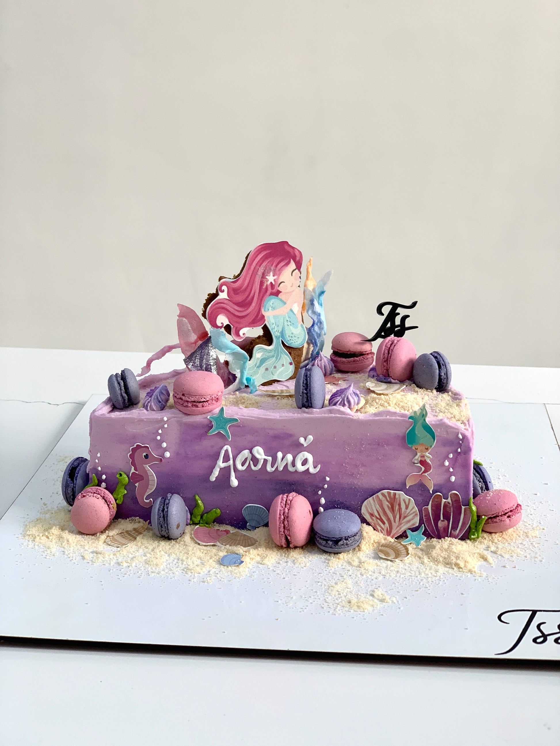 Decorative half birthday cake from The Sinful Spoon with colorful frosting and sprinkles, perfect for celebrating milestone birthdays.