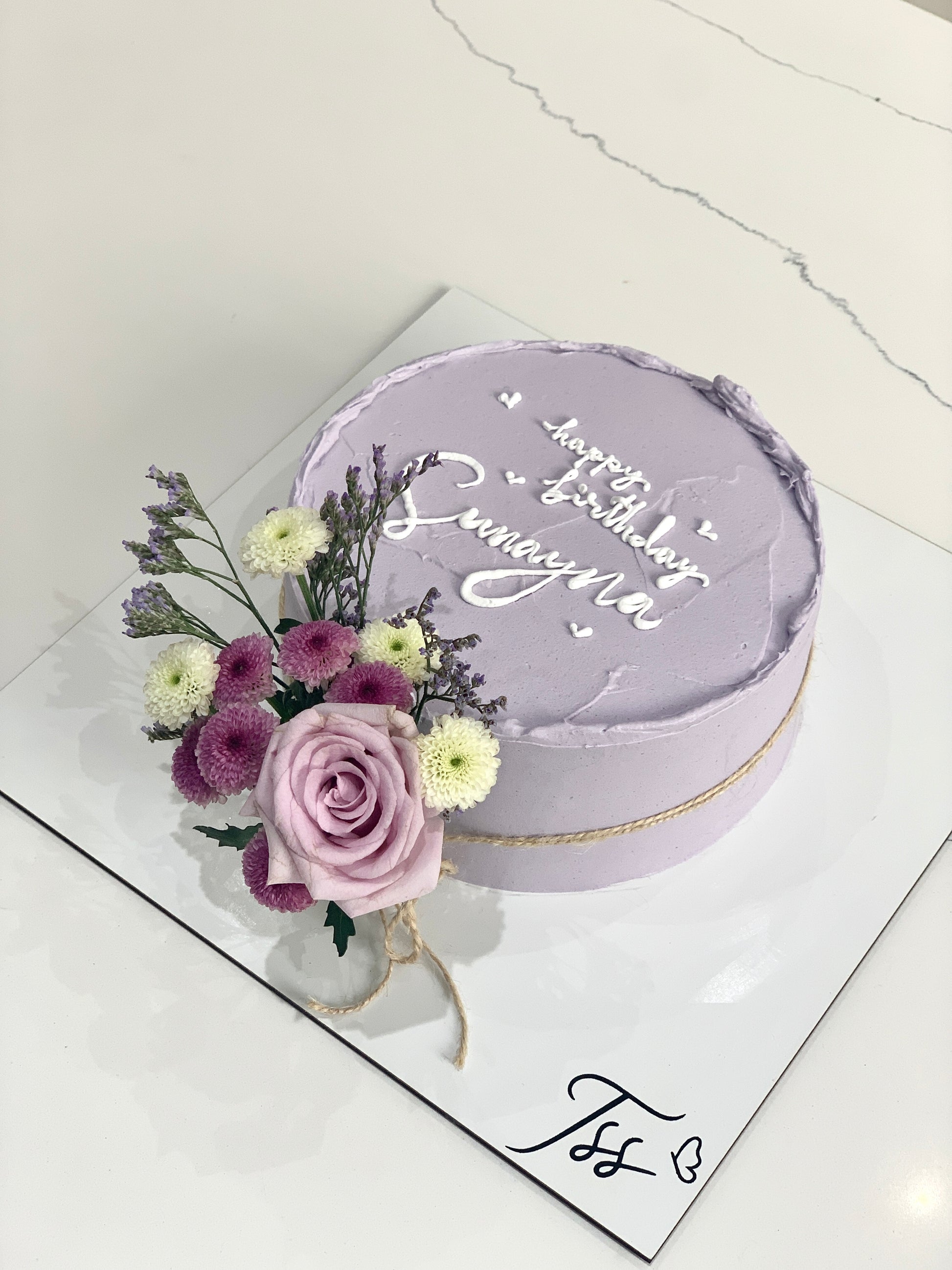 Fresh floral cakes from The Sinful Spoon featuring beautifully decorated cakes with vibrant floral designs.