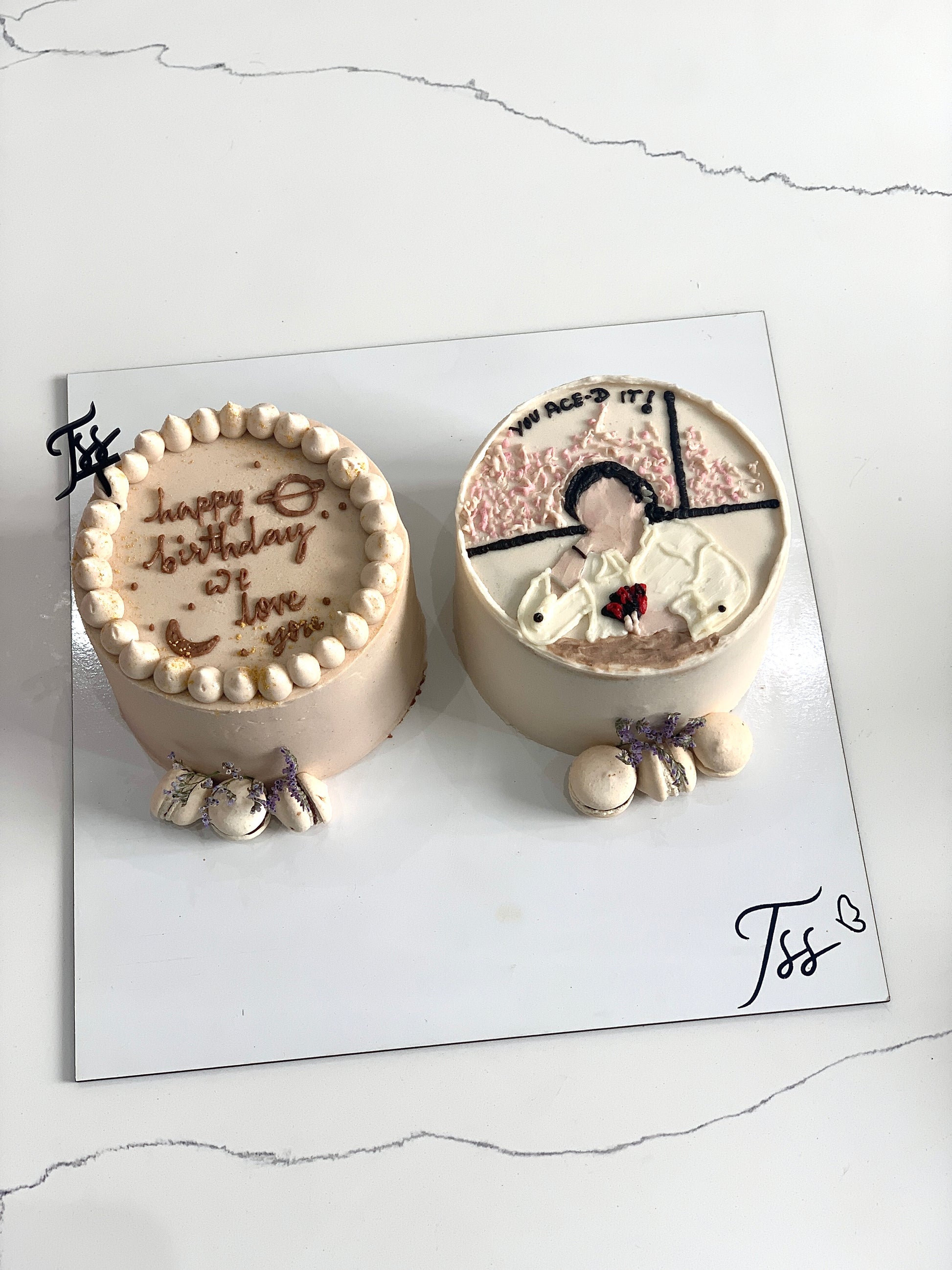 Assorted combo cakes from The Sinful Spoon with colorful frosting and decorative toppings on a white plate.