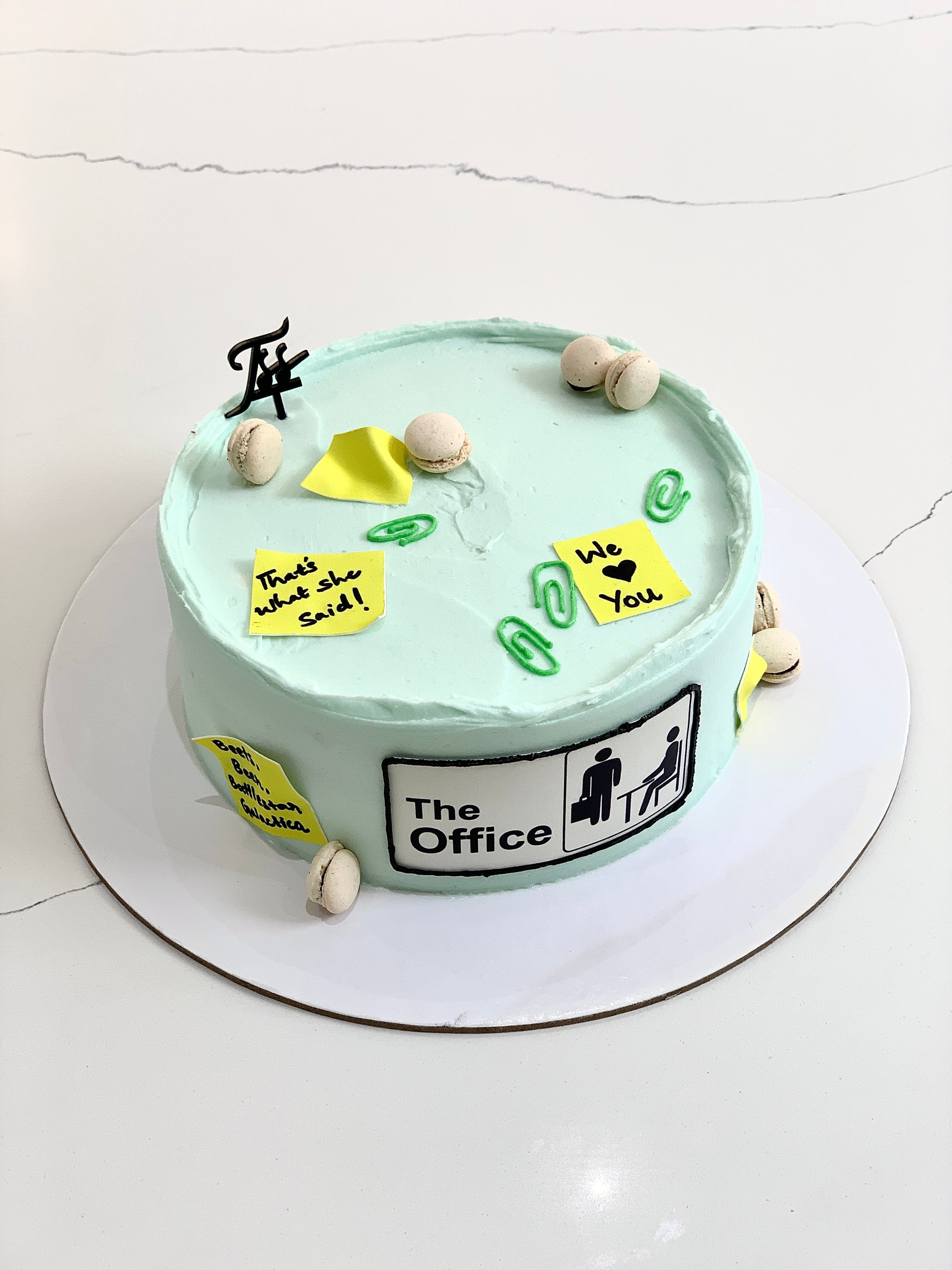 Edible paper cake decorated with colorful floral designs from The Sinful Spoon for special occasions.