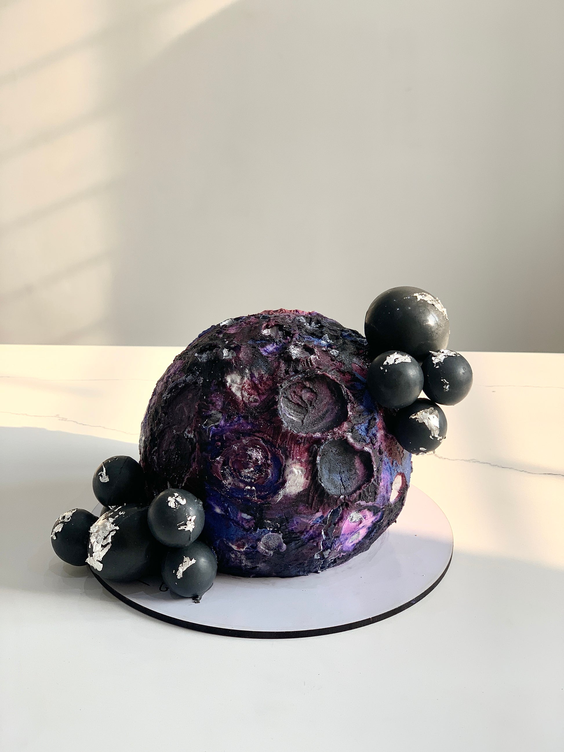 Colorful Shape Cakes from The Sinful Spoon arranged on a plate, featuring various geometric and fun shapes for celebration desserts.