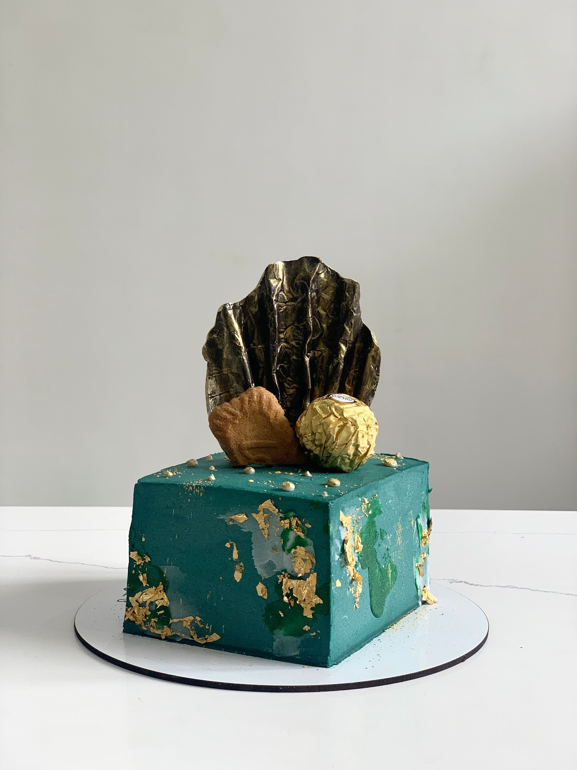 Decorative shape cakes from The Sinful Spoon featuring colorful, intricately designed cake shapes for special occasions.