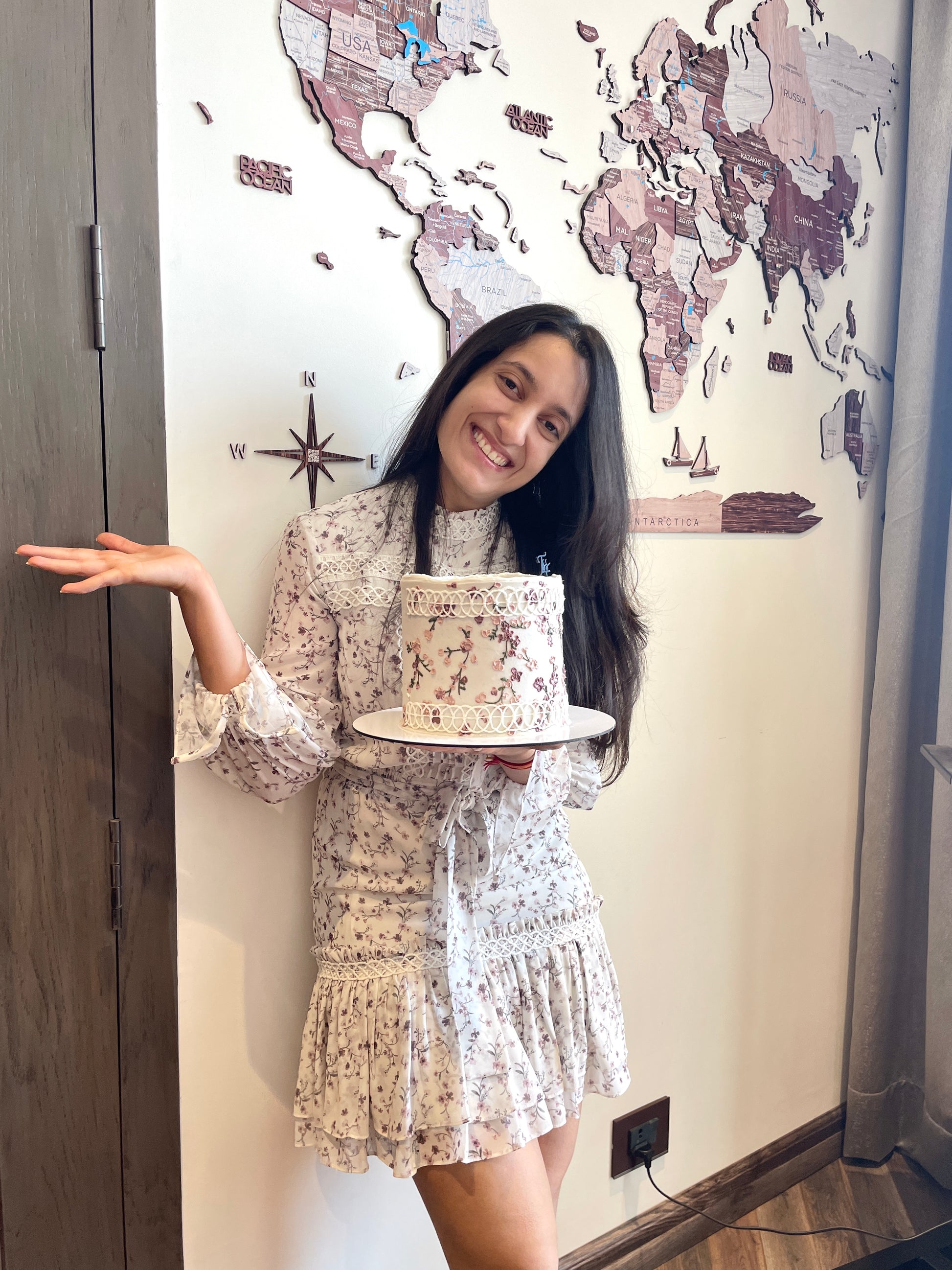 Decorative fashion cakes from The Sinful Spoon with colorful, intricate designs displayed on a white background.