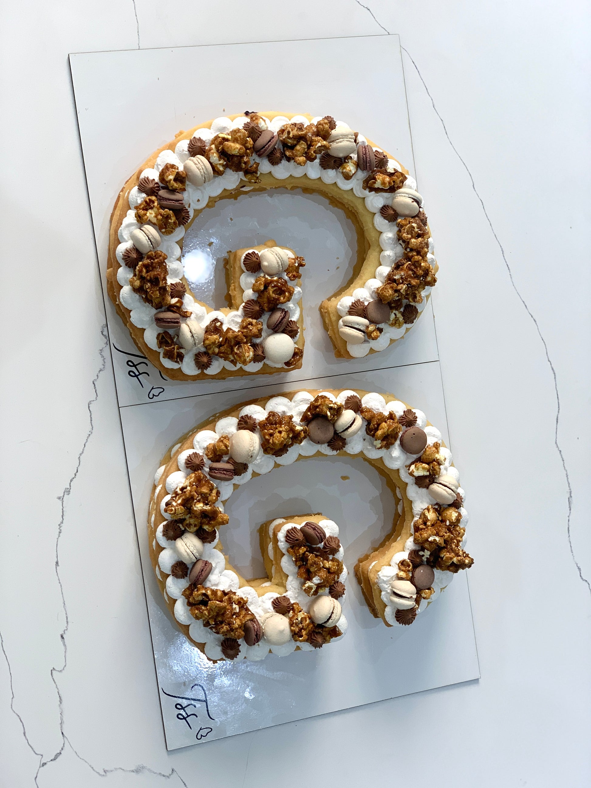 Chocolate chip cookie cake from The Sinful Spoon with gooey, melted chocolate chips on top and a golden-brown crust.