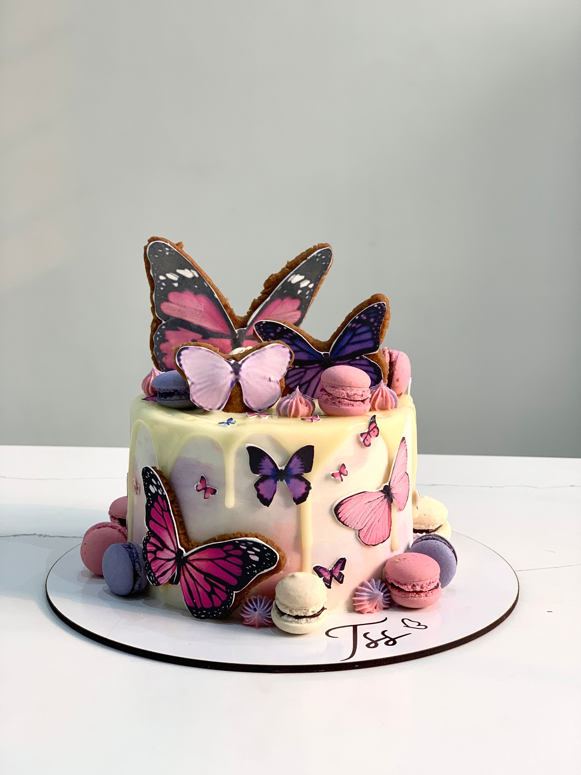 Edible paper cake with baby girl design from The Sinful Spoon, decorated with pastel colors and cute baby-themed details.