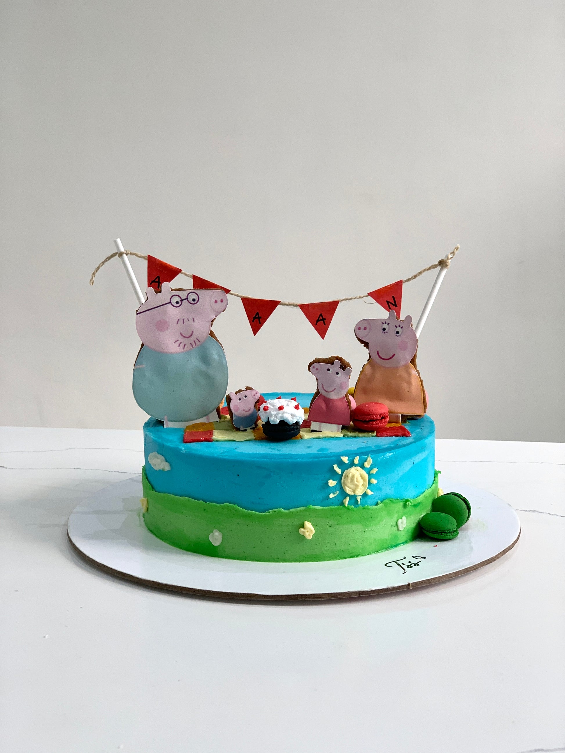 Edible paper cake topper featuring a baby girl design from The Sinful Spoon on a decorated cake.