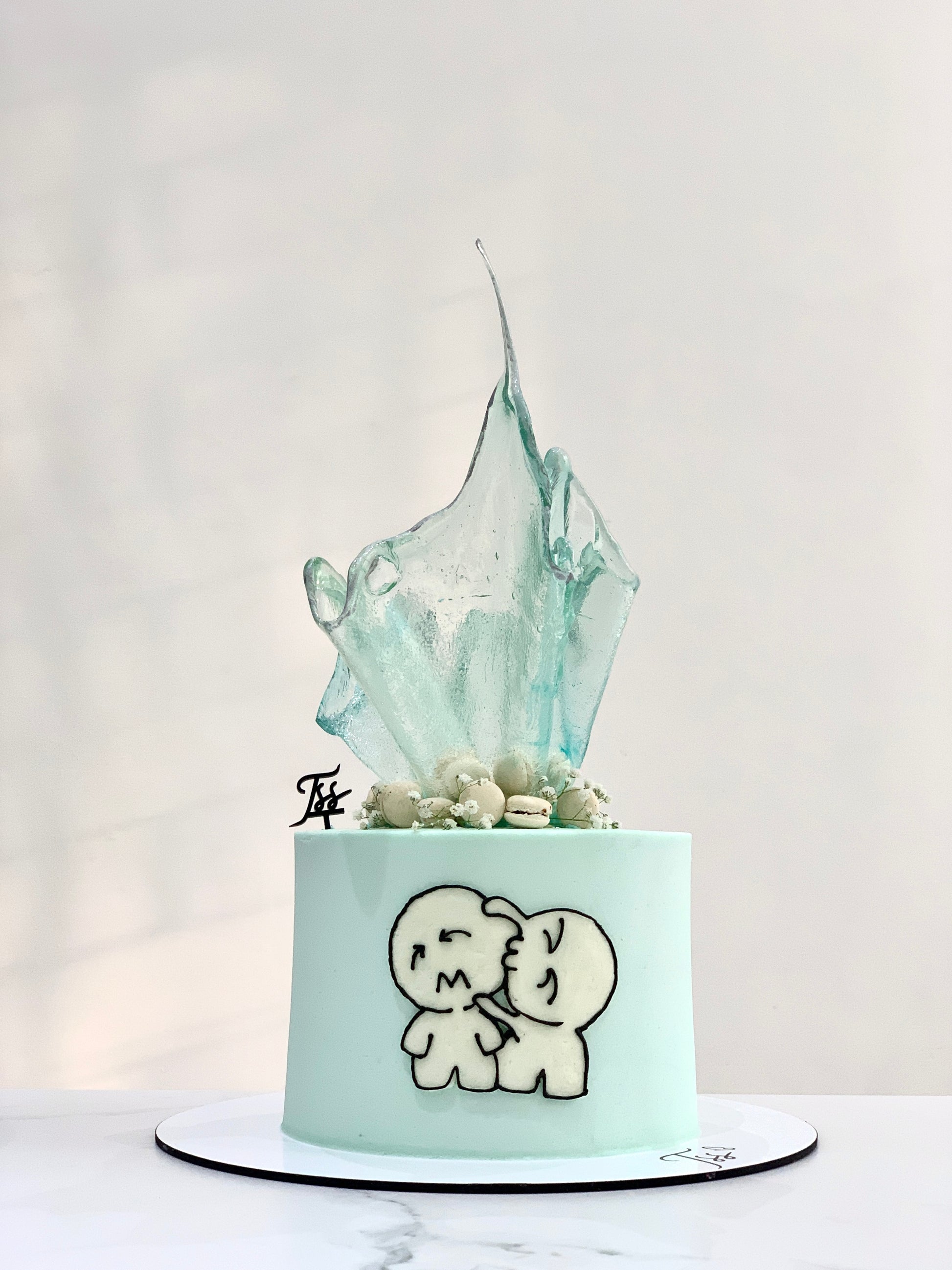 Colorful isomalt cake decorations from The Sinful Spoon, showcasing vibrant, glossy candy pieces for culinary artistry.
