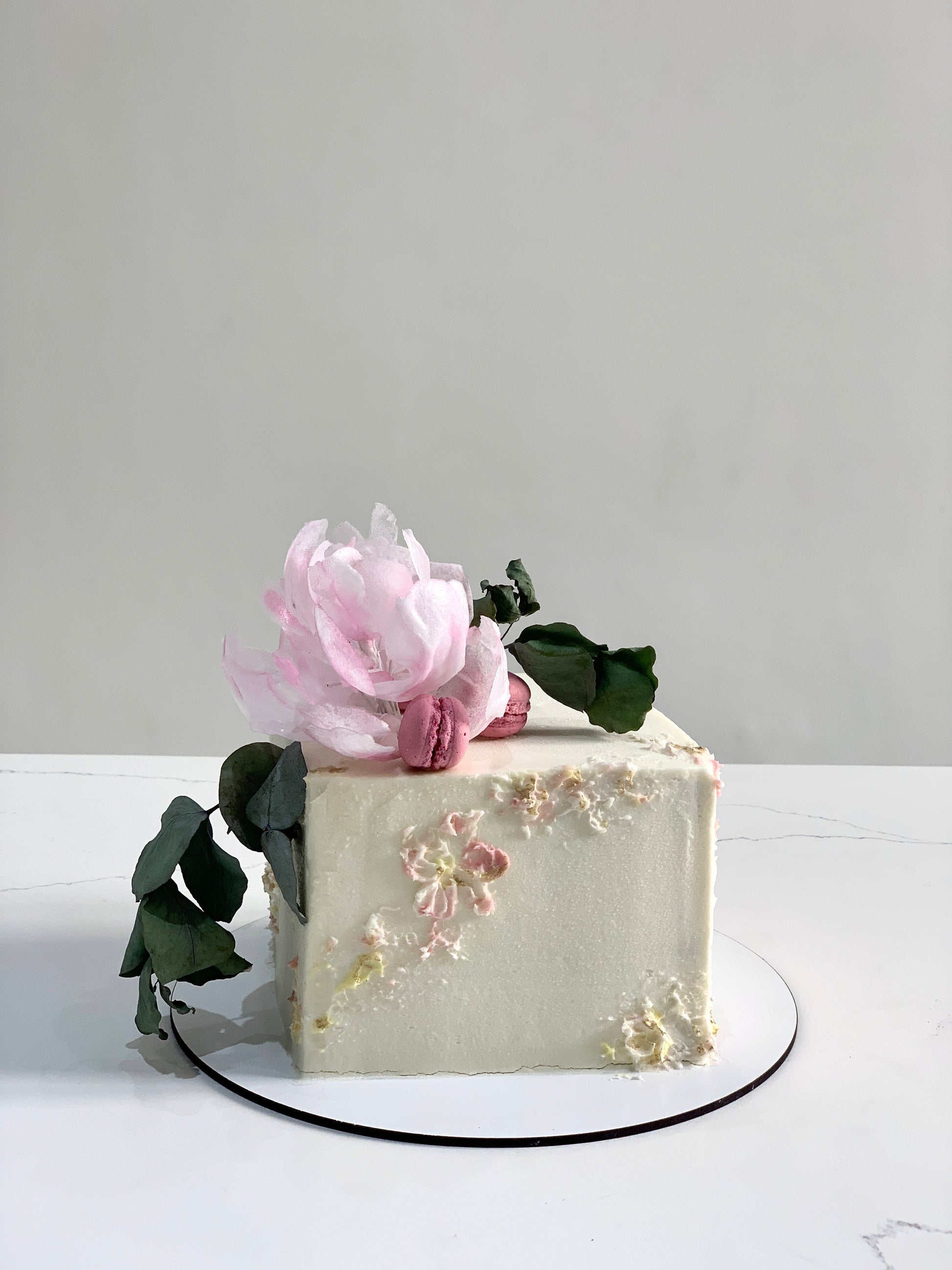 Decorative shape cakes from The Sinful Spoon, featuring colorful, intricately designed cake shapes on a white background.
